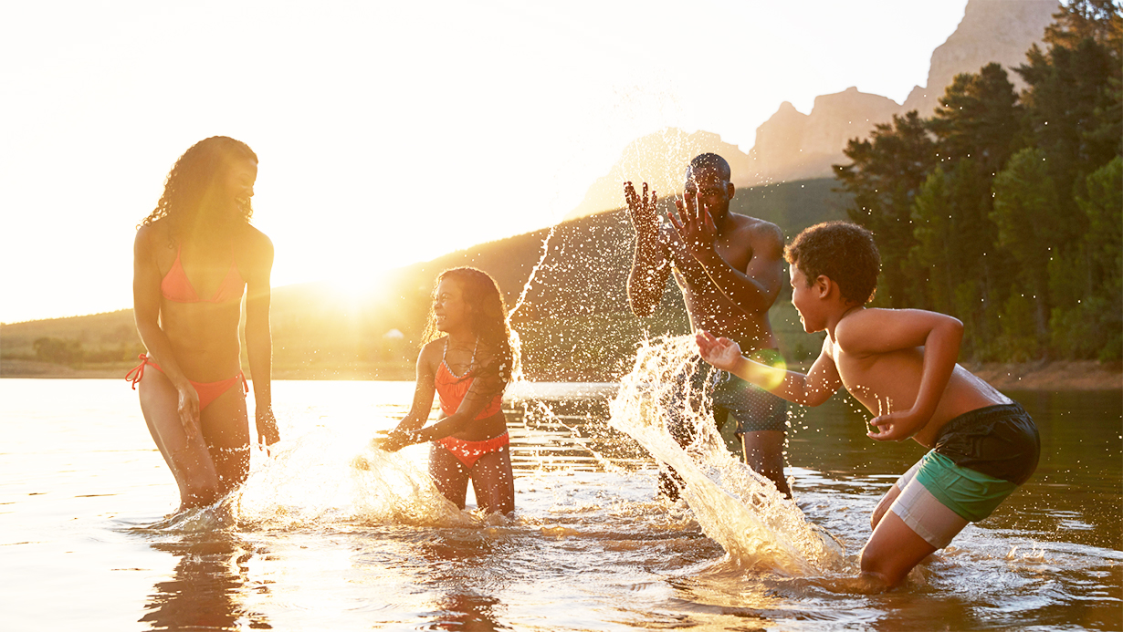 happy family
              splashing in water